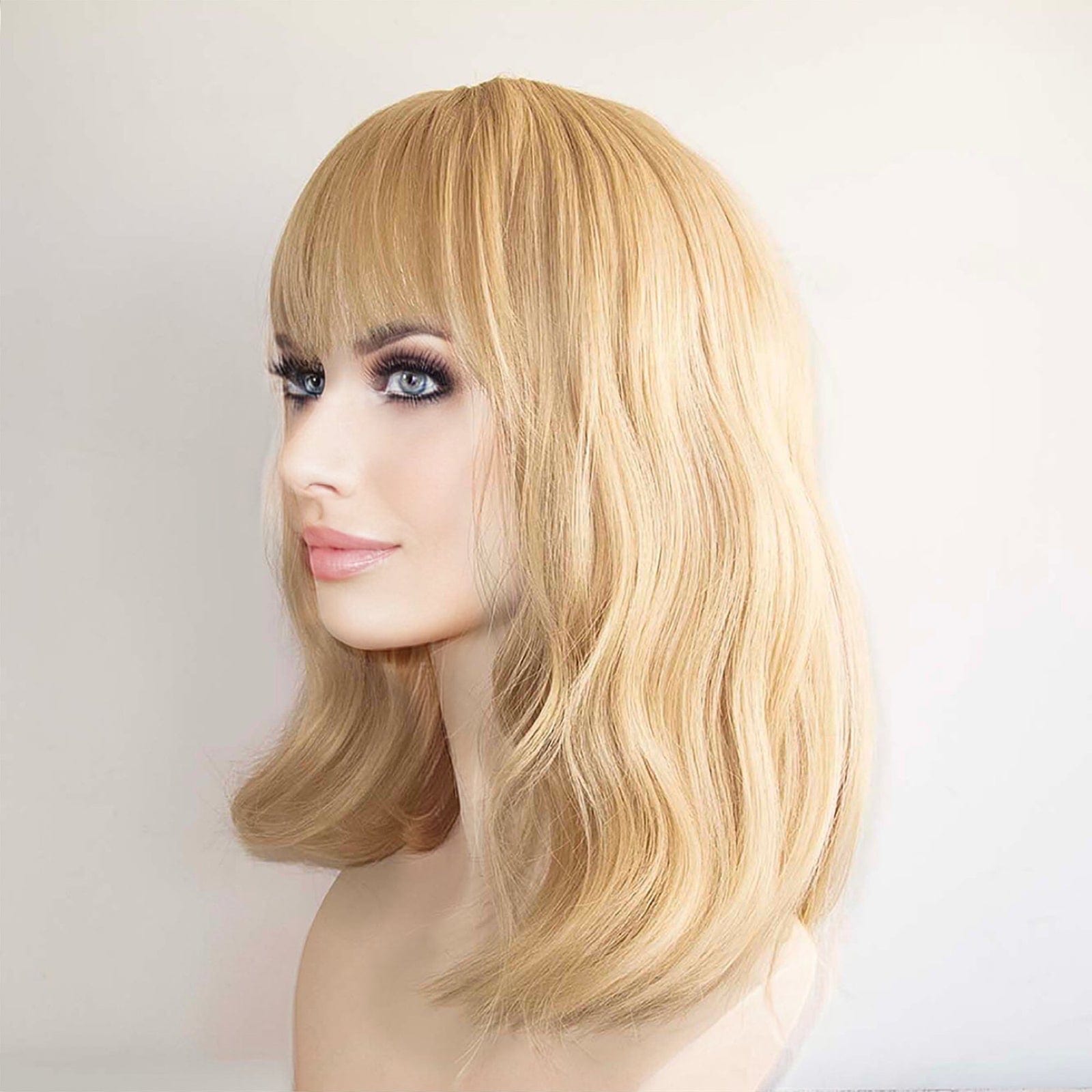 nevermindyrhead Women Golden Blonde Long Wavy Fringe Bangs Wig