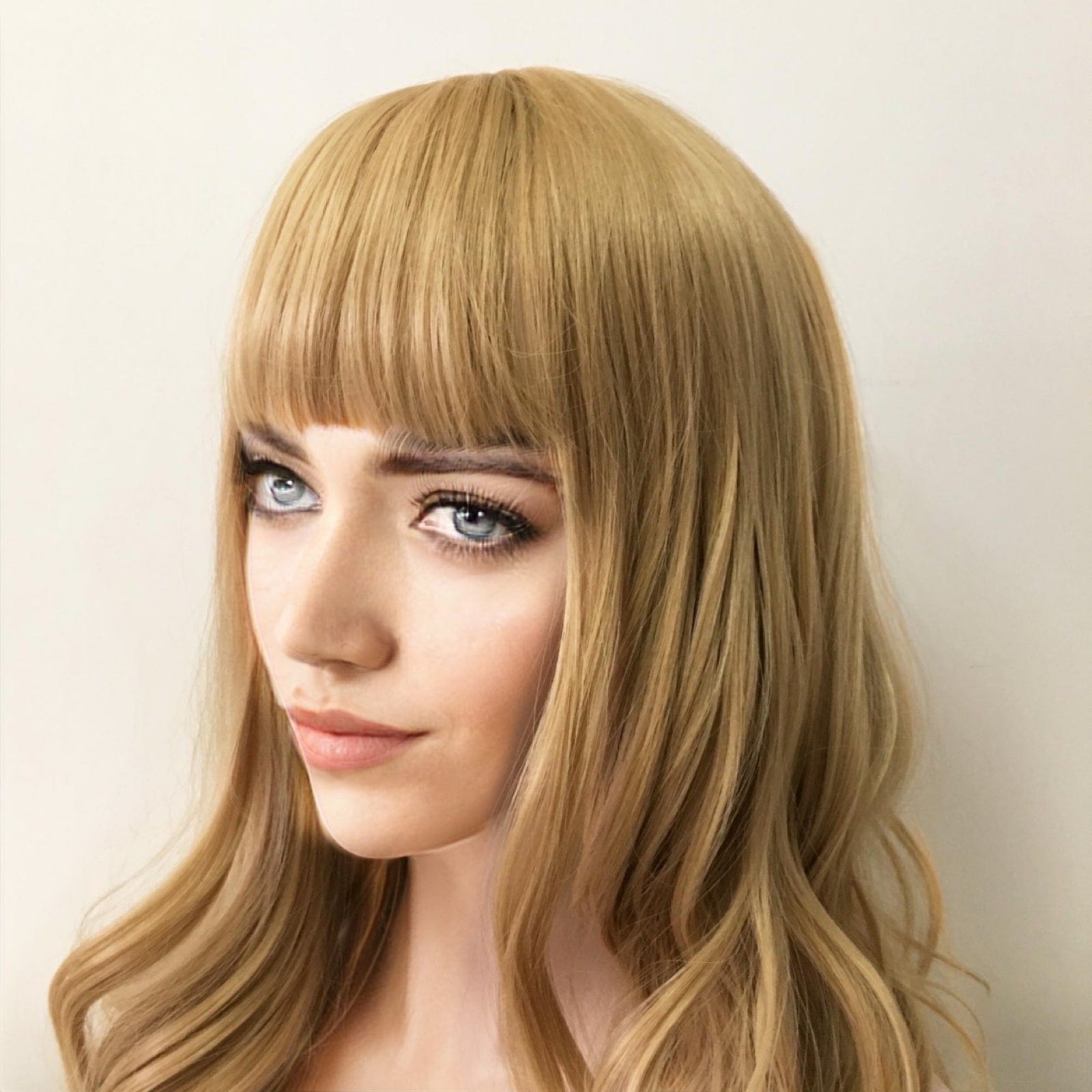 nevermindyrhead Women Blonde Long Curly Blunt Bangs Wig