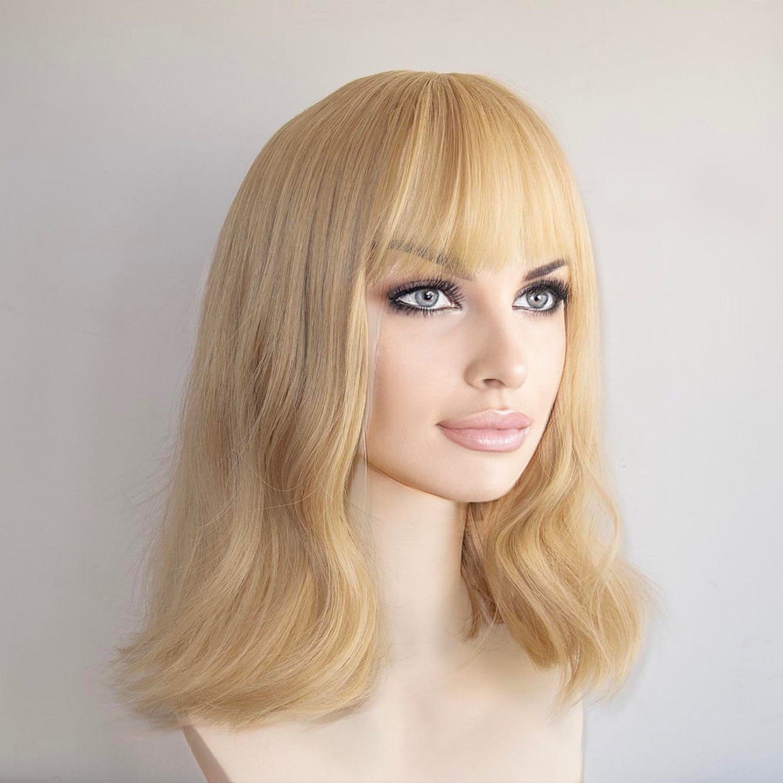 nevermindyrhead Women Golden Blonde Long Wavy Fringe Bangs Wig