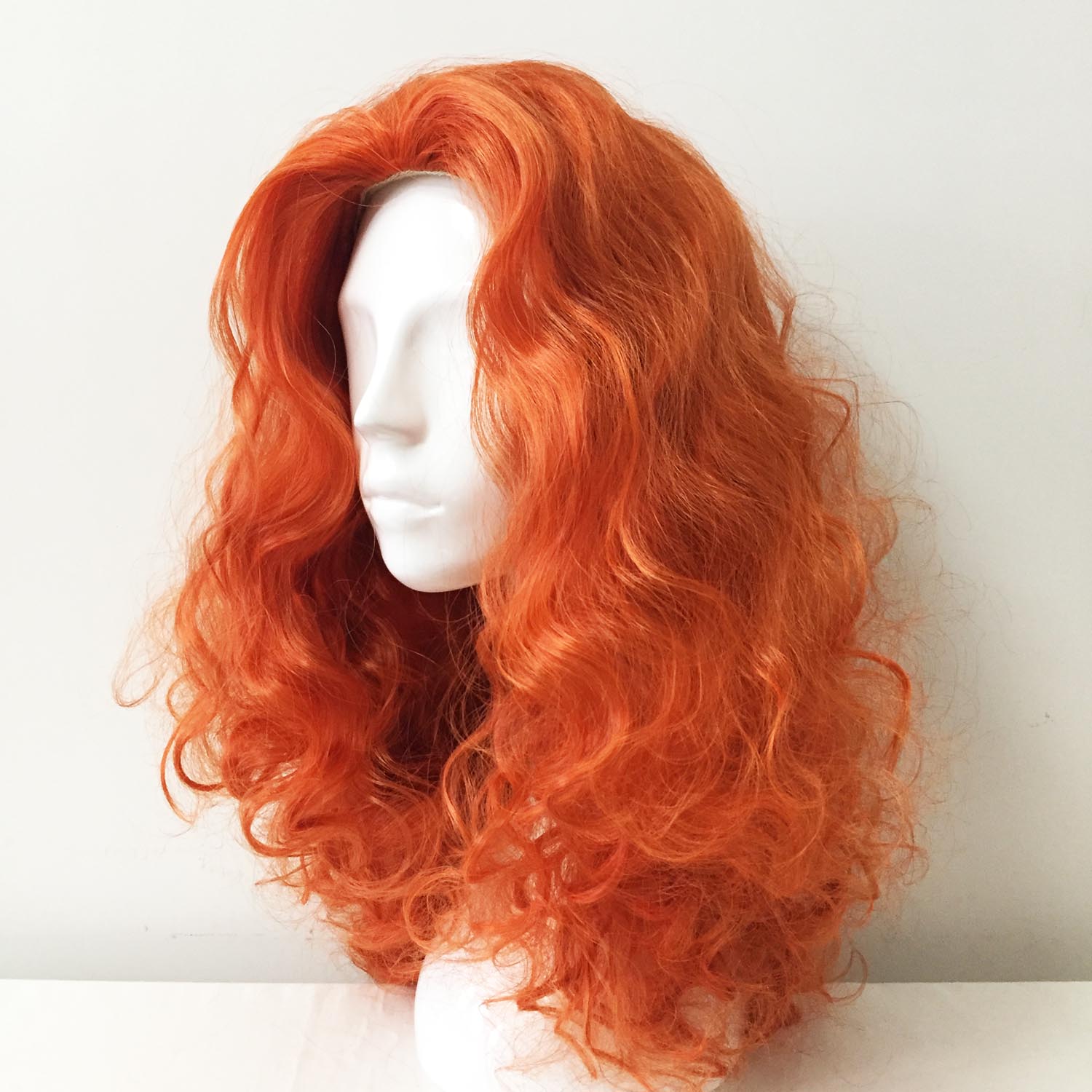 nevermindyrhead Women Orange Long Curly Slicked Back Fluffy Cosplay Wig