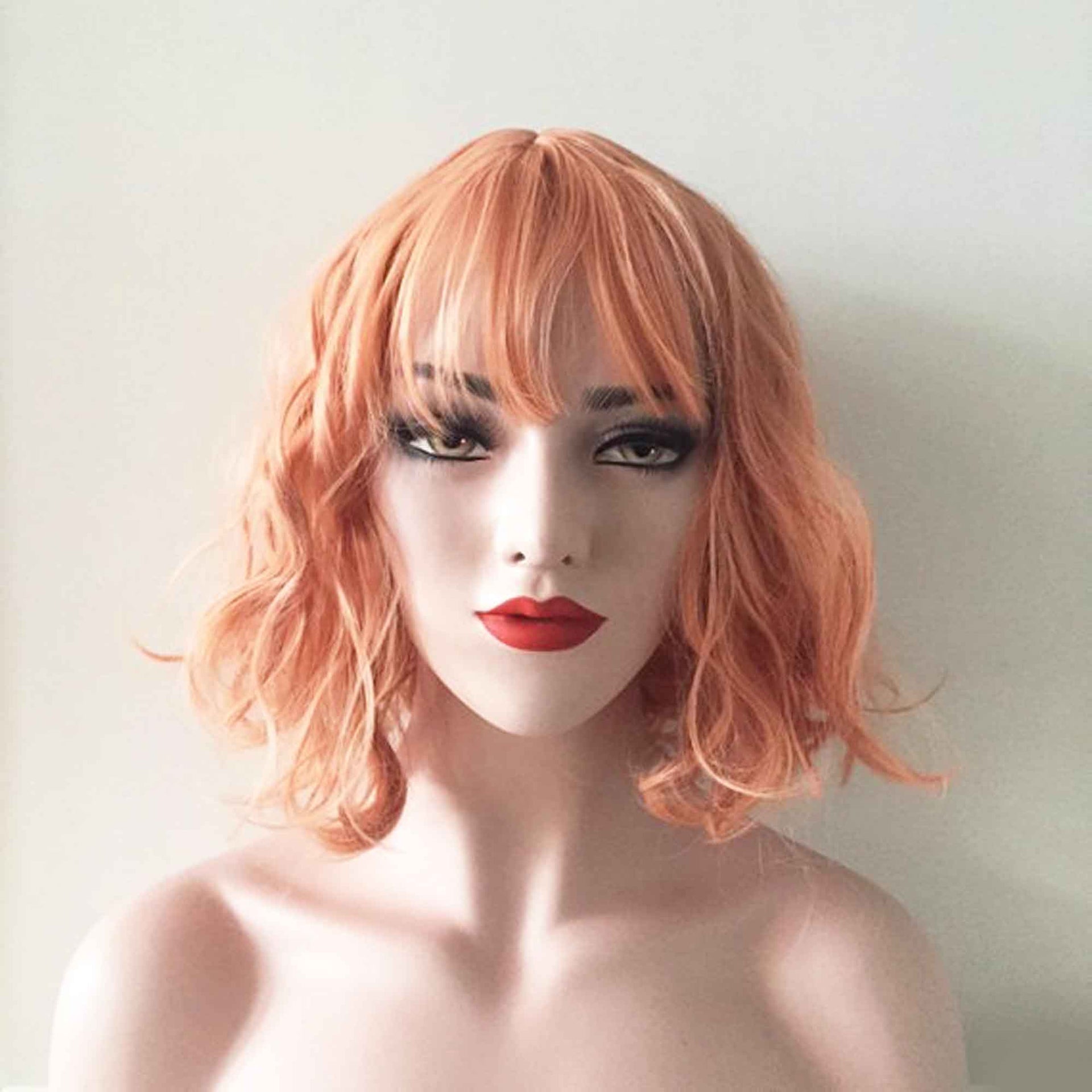 nevermindyrhead Women Orange Short Curly Bob Fringe Bangs Wig