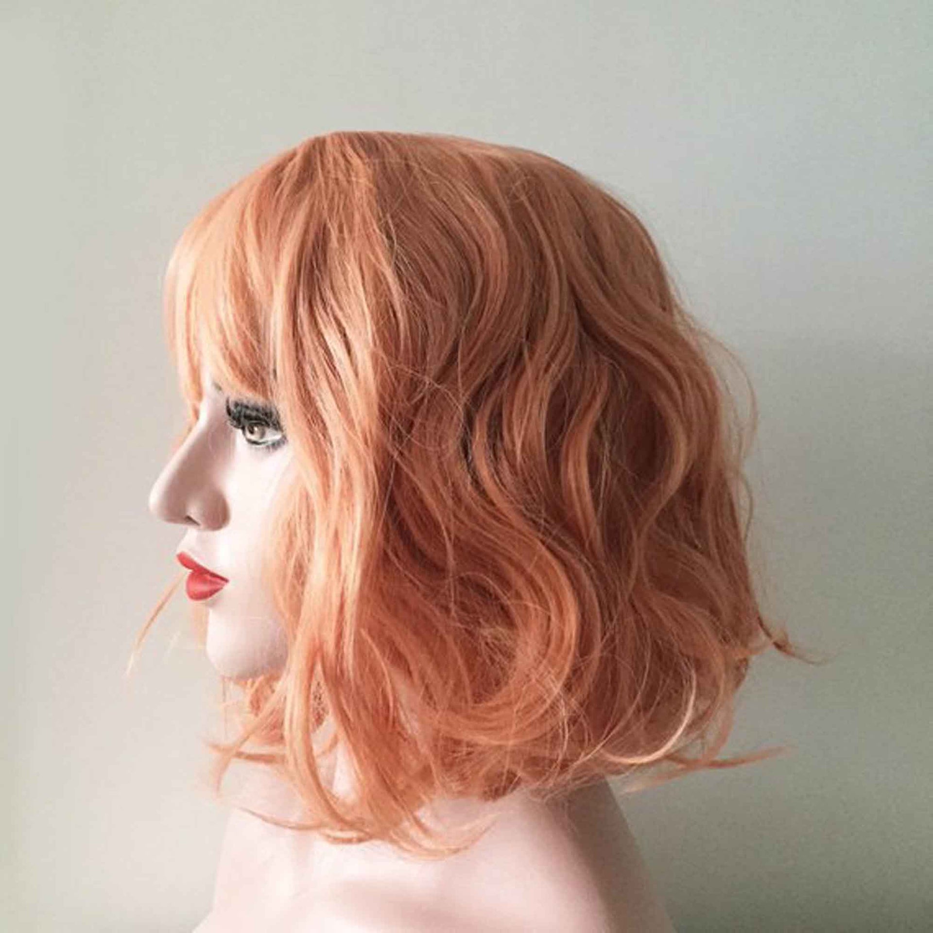 nevermindyrhead Women Orange Short Curly Bob Fringe Bangs Wig